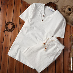 Cotton And Linen Two-piece Buckle Suit Casual V-neck Two-piece Set in white laid on wooden background.
