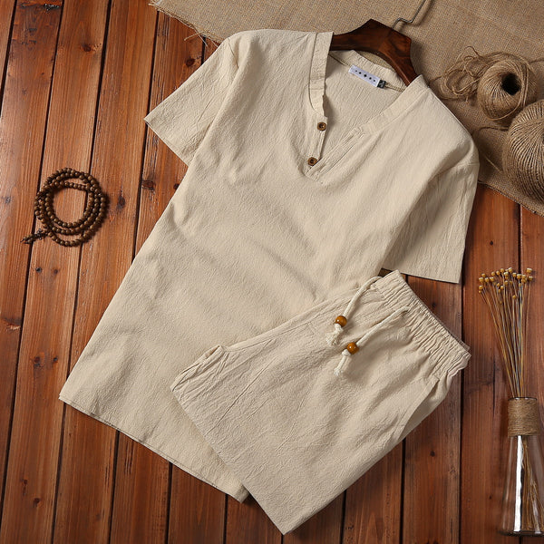 Cotton And Linen Two-piece Buckle Suit Casual V-neck Two-piece Set in beige color displayed on wooden background.